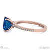 sapphire engagement ring with hidden halo and side stones rose gold with 18k rose gold metal and radiant shape diamond
