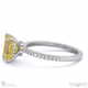 yellow natural diamond double hidden halo side stone engagement ring platinum with platinum metal and emerald shape diamond