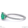 emerald cushion side stone claw engagement ring platinum with platinum metal and cushion shape diamond