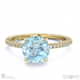 blue lab grown diamond hidden halo side stone engagement ring yellow gold with 18k yellow gold metal and round shape diamond