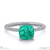 emerald cushion side stone claw engagement ring platinum with platinum metal and cushion shape diamond