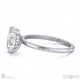 Moissanite Hidden Halo Oval Engagement Ring On Half-Rounded White Gold Band