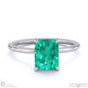 emerald radiant cut hidden halo engagement ring platinum with platinum metal and radiant shape diamond