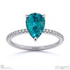 teal sapphire pear side stone claw engagement ring platinum with platinum metal and pear shape diamond