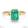 emerald emerald cut bezel setting split band yellow gold engagement ring with 18k yellow gold metal and emerald shape diamond
