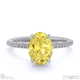 yellow lab grown diamond oval side stone claw engagement ring white gold with 18k white gold metal and oval shape diamond
