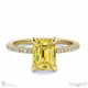 yellow natural diamond hidden halo claw set emerald cut side stone engagement ring yellow gold with 18k yellow gold metal and emerald shape diamond